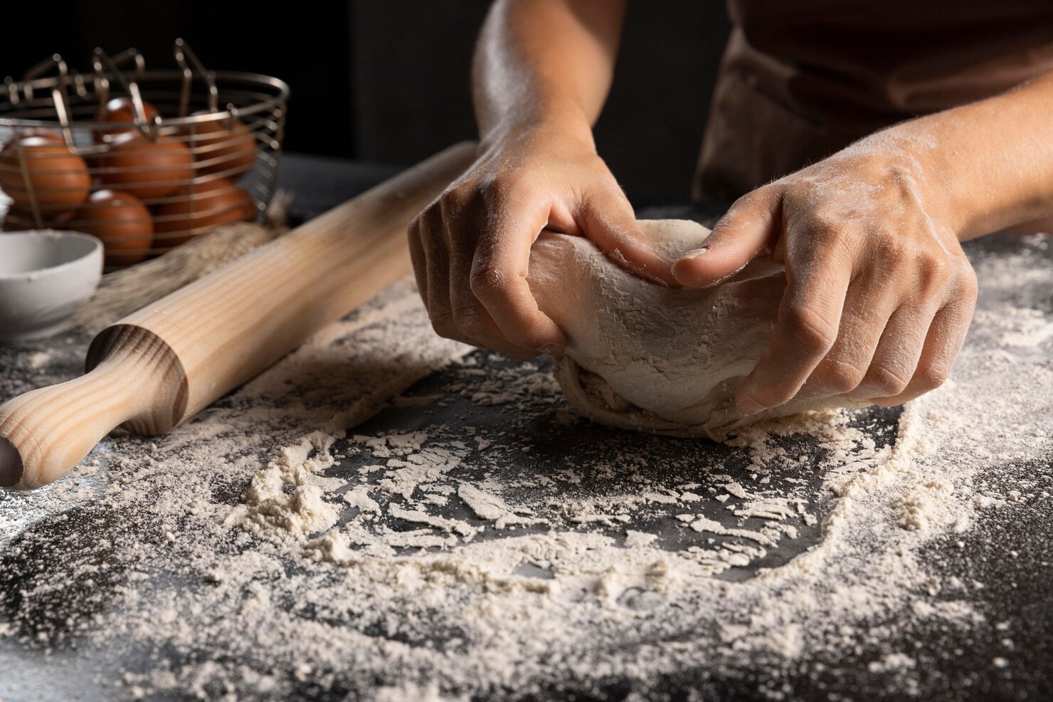 chef-kneading-dough-flour-table_23-2148742225